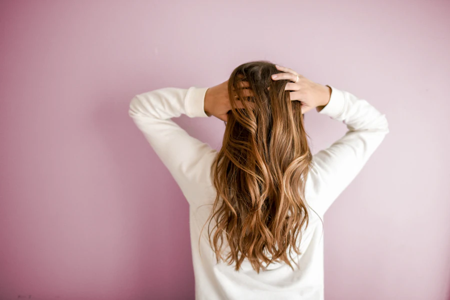 Long hair against a soft pink background